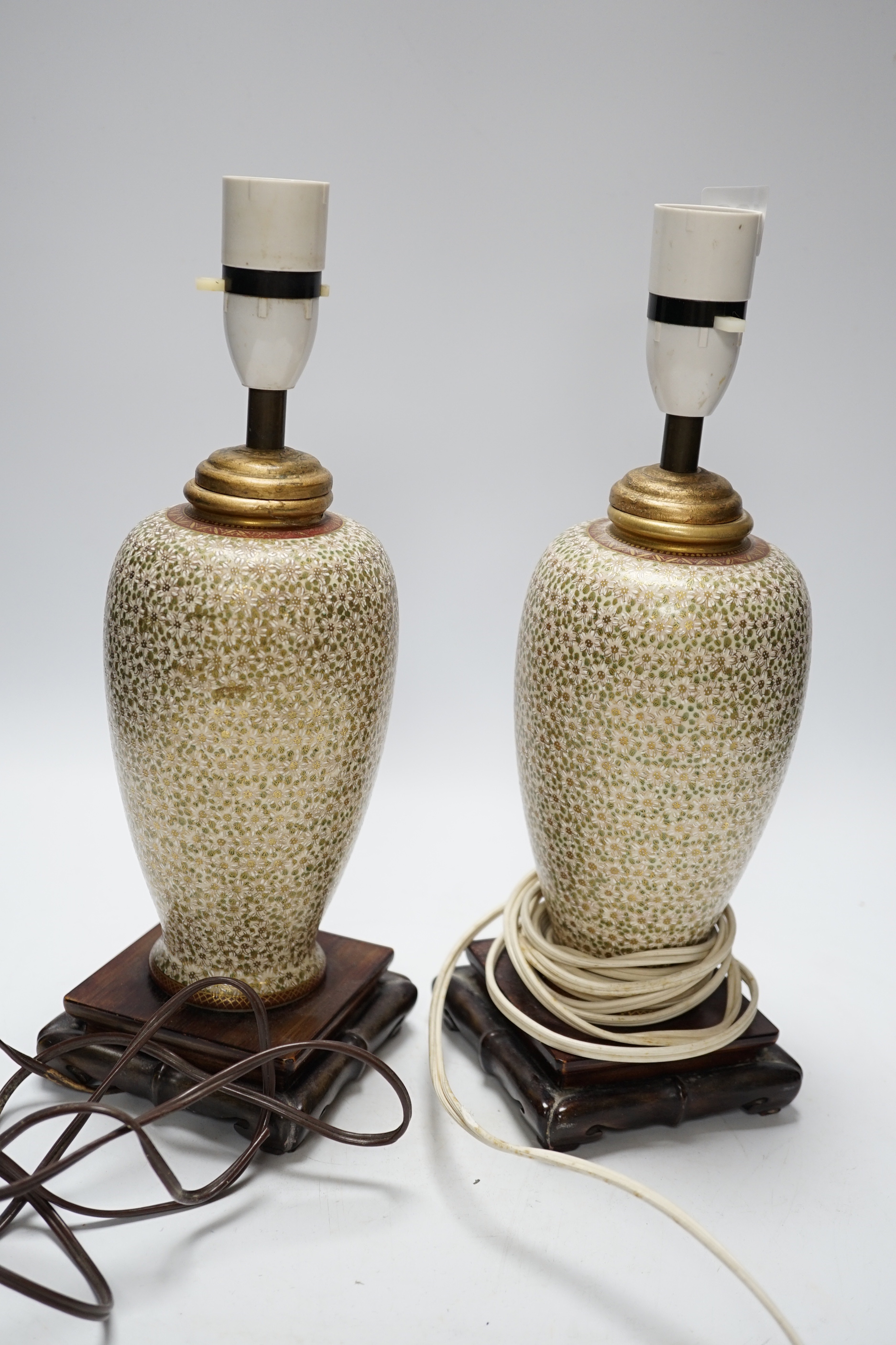 A pair of Japanese Satsuma vases mounted as lamps, total height including lamp fittings 31.5cm